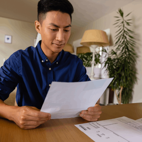 A student reviews transcripts and a diploma while Vietnamese Translation Services in Virginia prepare an academic submission.
