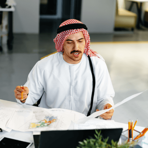 An IT lead validates Arabic API documentation on screen, using Arabic Translation Services in Virginia to keep technical.