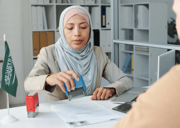 A certified translator stamps an Arabic birth record for a USCIS case, using Arabic Translation Services in Virginia.