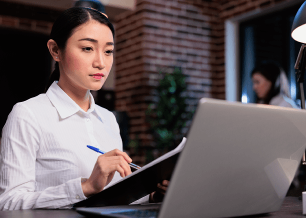 An analyst reviews a certified Chinese financial statement, using Chinese Translation Services in Virginia for compliance.