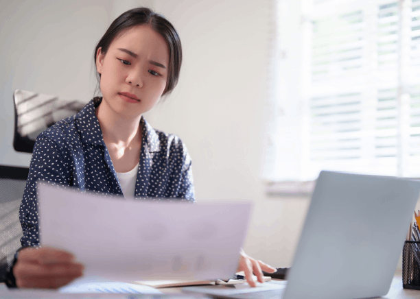 A client submits a birth certificate for certified Korean Translation Services in Virginia at a local document desk.