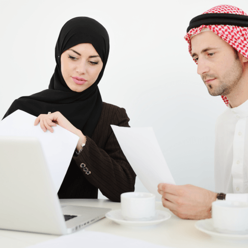 A contract specialist compares Arabic and English clauses, using Arabic Translation Services in Virginia for business.