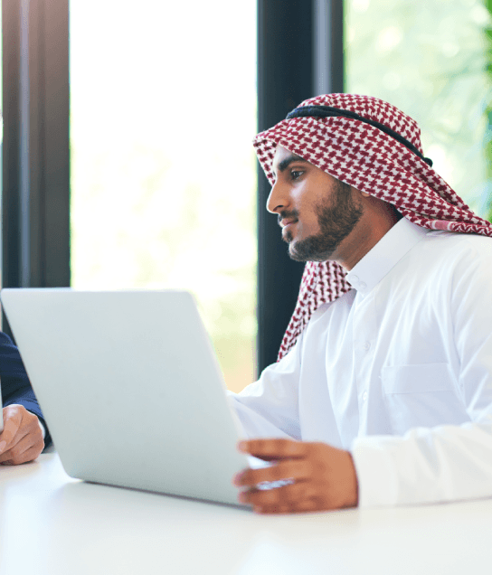 A translator checks a translated tax packet as Arabic Translation Services in Virginia support accurate financial filings.